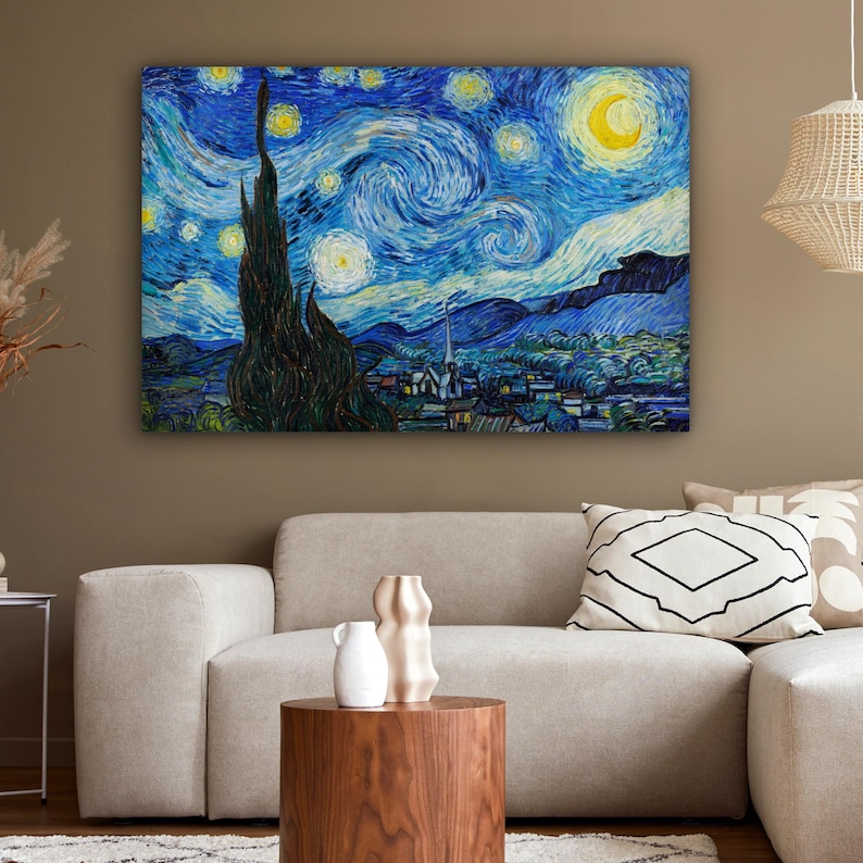 May include: A framed canvas print of Van Gogh's "The Starry Night" painting. The artwork depicts a swirling night sky with a crescent moon, stars, and a village. The color palette includes blues, yellows, and greens, creating a vibrant and iconic image.