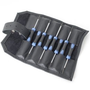 May include: A black leather roll-up case with a strap and seven blue and silver screwdrivers.