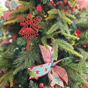 Topiary with red and glitter berries christmas tree