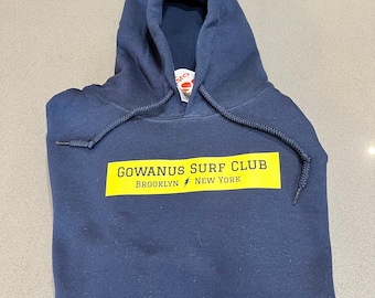 Classic Lightning Bolt Surf Hoodie by the Gowanus Surf Club | Navy Blue with Yellow Box | Vintage Retro Style Surf Hoodie from Brooklyn NYC