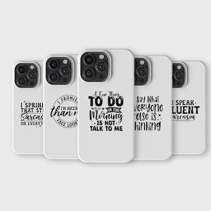 May include: A set of white phone cases, each printed with a different humorous quote in black. The quotes include phrases like "I speak fluent sarcasm" and "Say what everyone else is thinking".