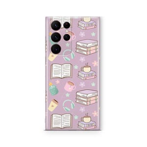 May include: A lavender phone case featuring a repeating pattern of books, coffee cups, headphones, candles, and flowers. The design is in a cartoon style with soft colors, creating a cozy and inviting aesthetic. The case is designed to fit a smartphone.