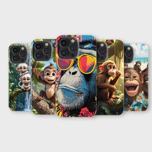May include: A selection of phone cases with cartoon monkey designs. The cases display different monkey illustrations, including a gorilla wearing sunglasses, monkeys on a tree branch, and monkeys at the beach. The cases have a glossy finish and are designed for smartphones.