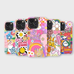 May include: A selection of phone cases with vibrant designs. The cases display smiley faces, flowers, rainbows, and phrases such as "Yay! You did great" and "Thanks!". The cases have a retro, groovy aesthetic.