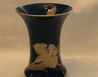 Vintage black shaped vase from the 80's with gold trim and flowers