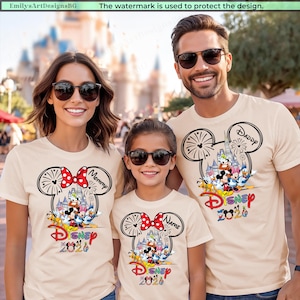 May include: Beige t-shirts with a Mickey Mouse head design, featuring a red polka dot bow and the word "Mommy", "Name", and "Daddy". The shirts have a Disney theme with the text "Disney 2020" and various cartoon characters.