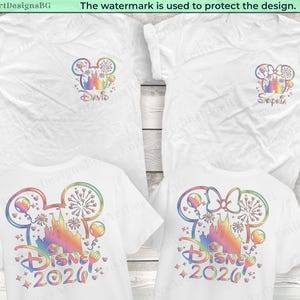 May include: White t-shirts with colorful Disney-themed designs. The shirts feature a Mickey Mouse head with a castle, fireworks, and balloons. One shirt says "David" and another says "Sophia". The bottom shirts say "Disney 2020".