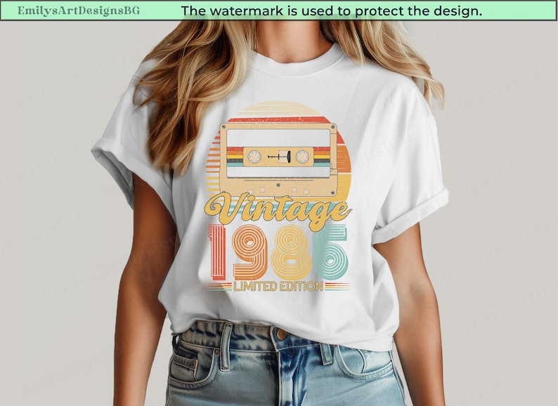 May include: White t-shirt featuring a retro design with a cassette tape illustration. The design includes the words "Vintage 1985 Limited Edition" in a colorful, nostalgic style. The shirt is a classic crew neck.