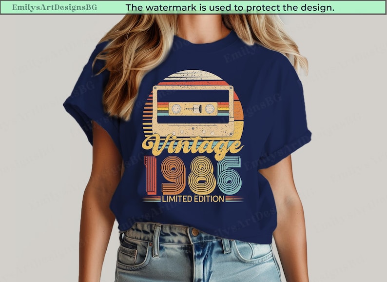 May include: Navy blue t-shirt featuring a retro design with a cassette tape, a sunset, and the text "Vintage 1986 Limited Edition." The design incorporates orange, yellow, and teal colors.