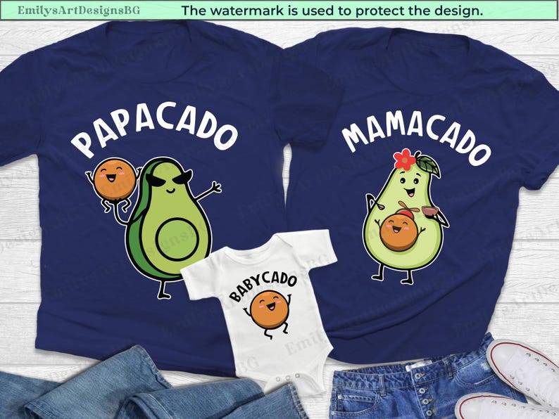 May include: Three navy blue t-shirts with avocado and peach illustrations. The shirts have the text "PapaCado", "MamaCado", and "BabyCado".