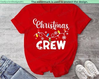May include: Red t-shirt with white text that says "Christmas Crew" and a string of colorful Christmas lights.