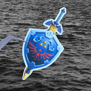 Espada Maestra y Escudo Hylian - La Leyenda de Zelda - Pegatina