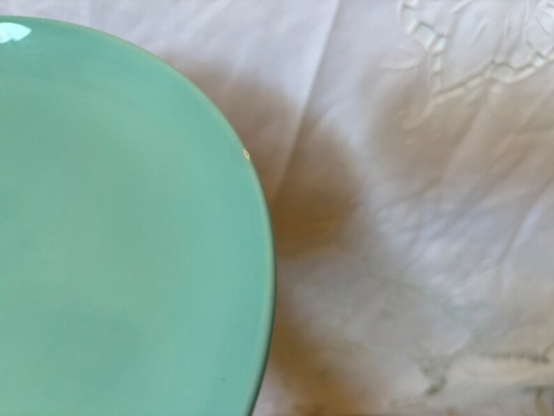 May include: A light blue ceramic bowl with a smooth, glossy finish.