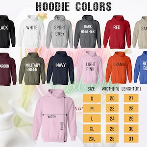 May include: A chart showing hoodie colors and sizes. The colors include black, white, sport grey, dark heather, red, sand, maroon, military green, navy, light pink, orange, and royal blue. The size chart shows sizes S, M, L, XL, and 2XL with corresponding width and length measurements in inches.
