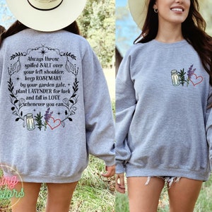 May include: Gray sweatshirt with a floral design and the text "Always throw spilled SALT over your left shoulder. keep ROSEMARY by your garden gate. plant LAVENDER for luck and fall in LOVE whenever you can."