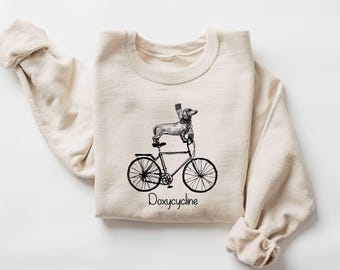 Doxycycline Pharmacy Pun Sweatshirt, Dachshund on Bicycle, Pharmacists Hoodie, Pharmacists and Technicians Gift, Veterinary,Pharmacist Gifts