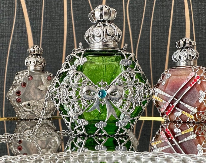 Vintage glass perfume bottle  with a bow ornament, with a chain, 7 ml.