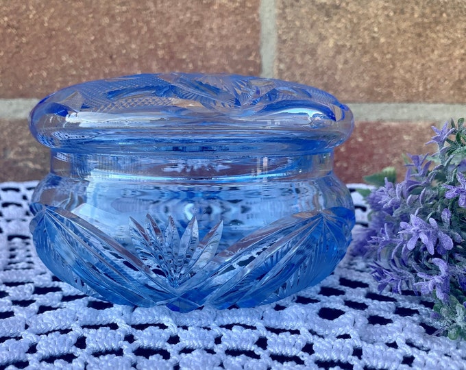 Glass sugar bowl from light blue cut glass