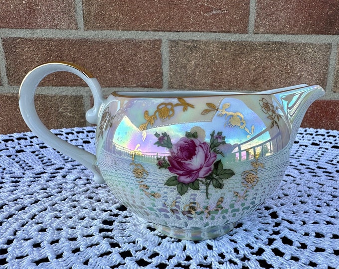 Pearlescent porcelain sauce boat. Gravy boat with gold rim  by Kahla. Made in GDR