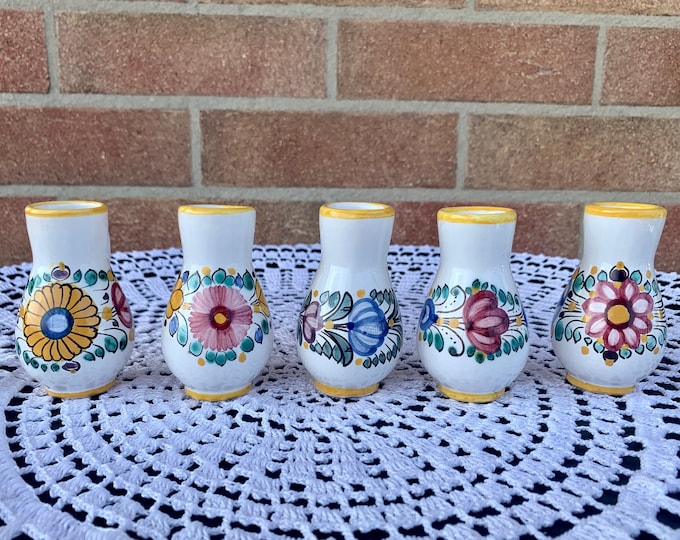 Set of five little ceramic decanters.