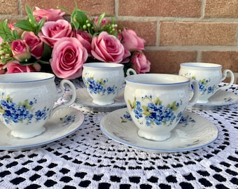 Set of 4 elegant collectible porcelain coffee cups with forget-me-nots - the perfect gift for porcelain lovers