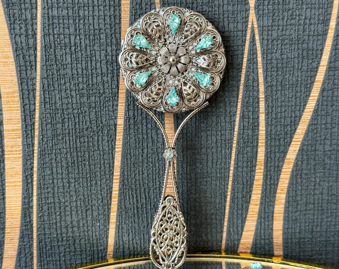 Unique handmade vintage mirror decorated with blue glittering rhinestones