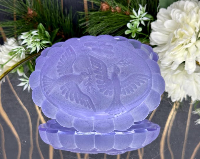 Frosted glass jar with doves on the lid