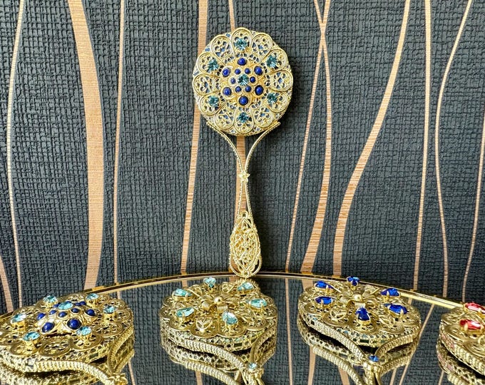 Unique handmade vintage mirror decorated with blue glittering rhinestones