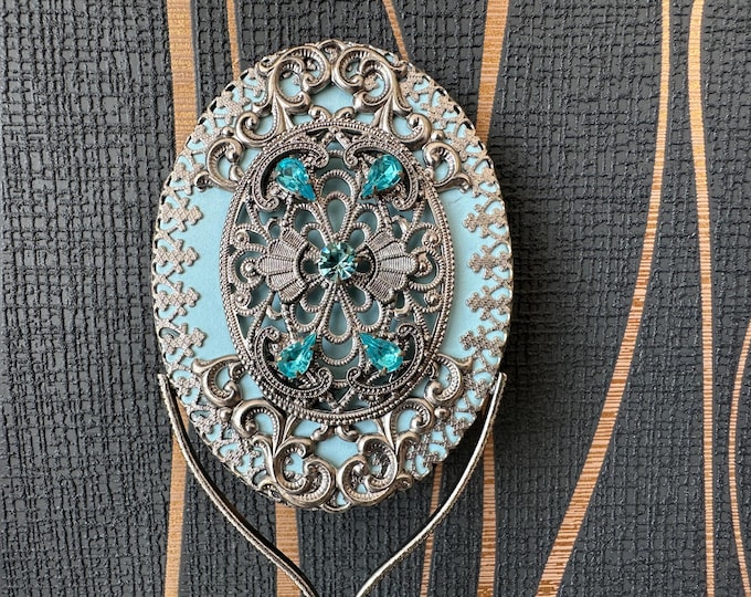 Glamorous handmade vintage mirror inlaid with light blue stones