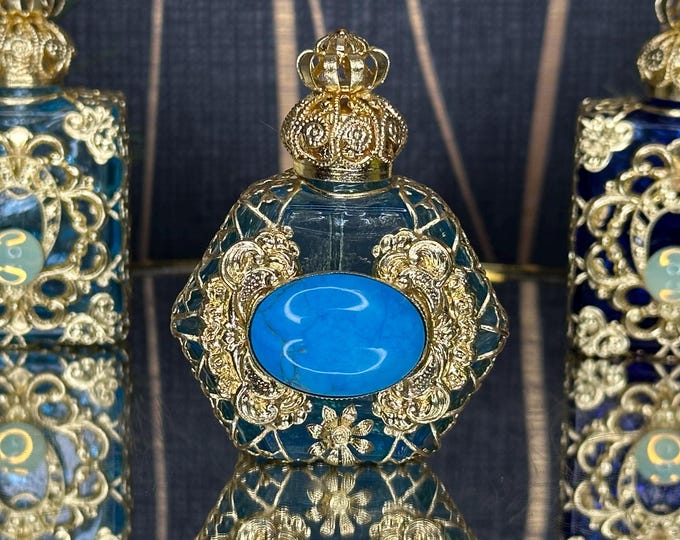 Elegant Perfume Bottle in Light Blue with Gold Ornament