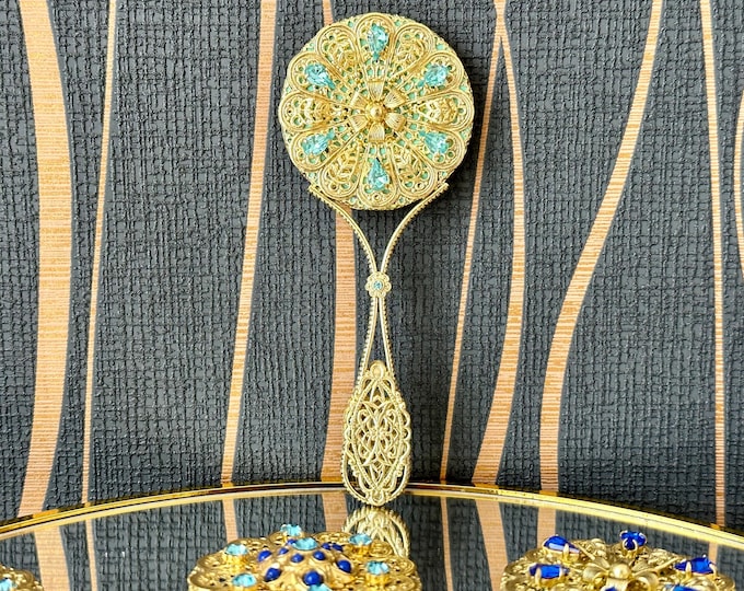 Unique handmade vintage mirror decorated with blue glittering rhinestones