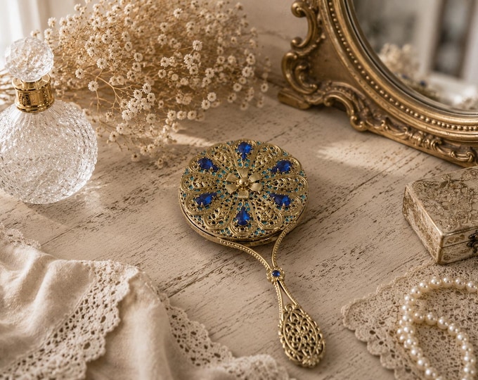 Unique handmade vintage mirror decorated with blue glittering rhinestones