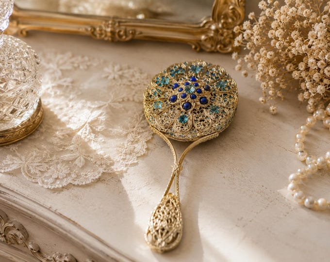 Unique handmade vintage mirror decorated with blue glittering rhinestones