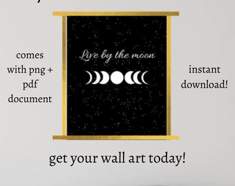 May include: Printable wall art with a black background and gold frame. The text "Live by the moon" is written in white with a white moon phase graphic below it. The text "instant download!" is written in white on the right side of the image.