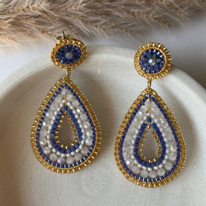 Handmade earrings made of Miyuki and glass beads in gold blue white, in Miguel Ases style