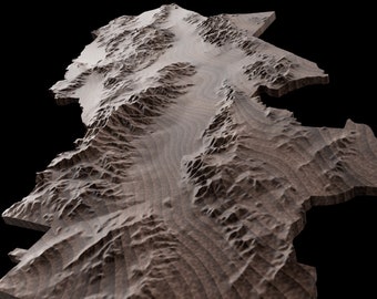 May include: A wooden sculpture of a mountain range with a river running through it. The sculpture is made of dark wood with a natural grain pattern.