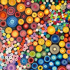 May include: A colorful abstract art piece made of paper circles of various sizes and colors. The circles are arranged in a swirling pattern, creating a sense of movement and energy.