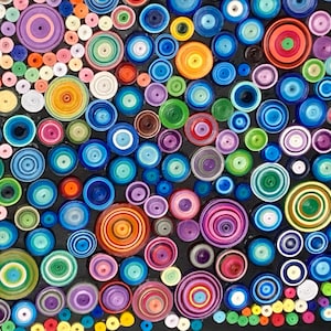 May include: A colorful abstract art piece made of paper circles of various sizes and colors. The circles are arranged in a random pattern on a black background.