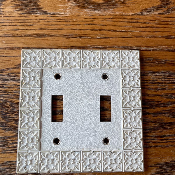 Vintage cast solid brass (2 switch) light switch plate. Hand painted white & gold highlights