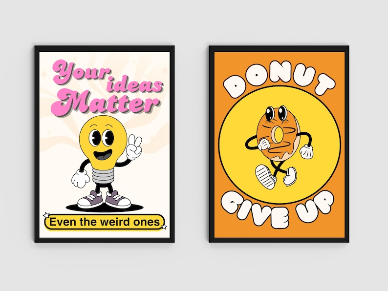 May include: Two framed retro-style art prints. One features a cartoon lightbulb with the text "Your ideas Matter" and "Even the weird ones." The other shows a cartoon donut with the text "Donut Give Up" on an orange background.