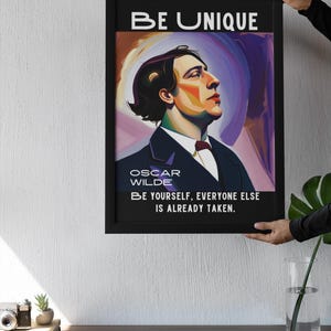 May include: Black framed art print featuring a portrait of Oscar Wilde with the text "BE UNIQUE" at the top. The print includes the quote "BE YOURSELF, EVERYONE ELSE IS ALREADY TAKEN."