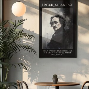 May include: A framed black and white portrait of Edgar Allan Poe hangs on a wall. The text at the top reads "EDGAR ALLAN POE." Below the portrait, the text reads "THE SCARIEST MONSTERS ARE THE ONES THAT LURK WITHIN OUR SOULS..." The image is in a room with a table and chairs.