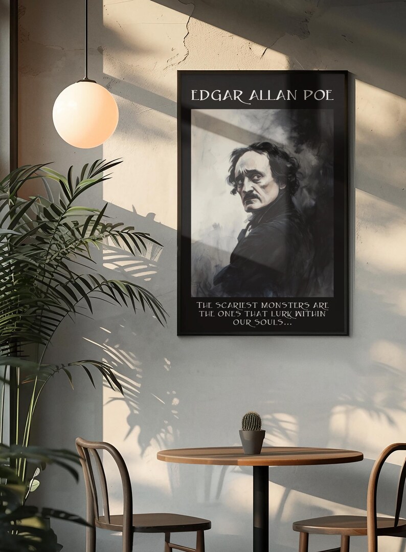 May include: A framed black and white portrait of Edgar Allan Poe hangs on a wall. The text at the top reads "EDGAR ALLAN POE." Below the portrait, the text reads "THE SCARIEST MONSTERS ARE THE ONES THAT LURK WITHIN OUR SOULS..." The image is in a room with a table and chairs.