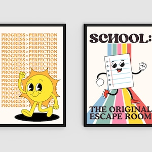 May include: Two framed art prints. The left print features a cartoon sun with the text "PROGRESS > PERFECTION" in a repeating pattern. The right print shows a cartoon paper with the text "SCHOOL: THE ORIGINAL ESCAPE ROOM".