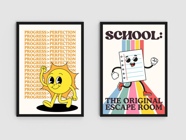 May include: Two framed art prints. The left print features a cartoon sun with the text "PROGRESS > PERFECTION" in a repeating pattern. The right print shows a cartoon paper with the text "SCHOOL: THE ORIGINAL ESCAPE ROOM".
