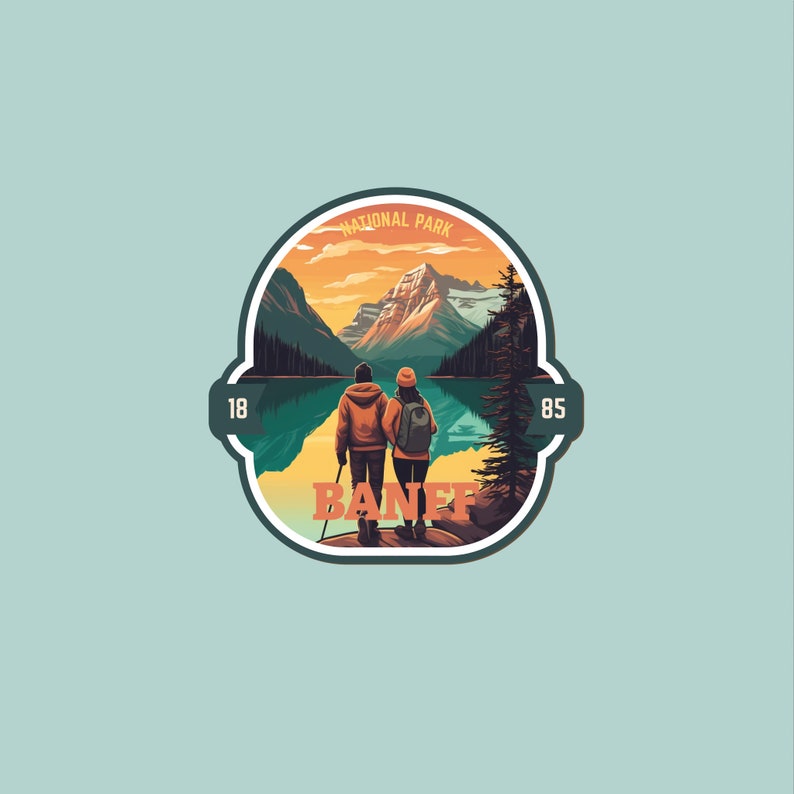 May include: A vintage-style sticker featuring a scenic mountain landscape with a lake and two hikers. The sticker says "Banff National Park" with the years "1885" and "85" on either side.