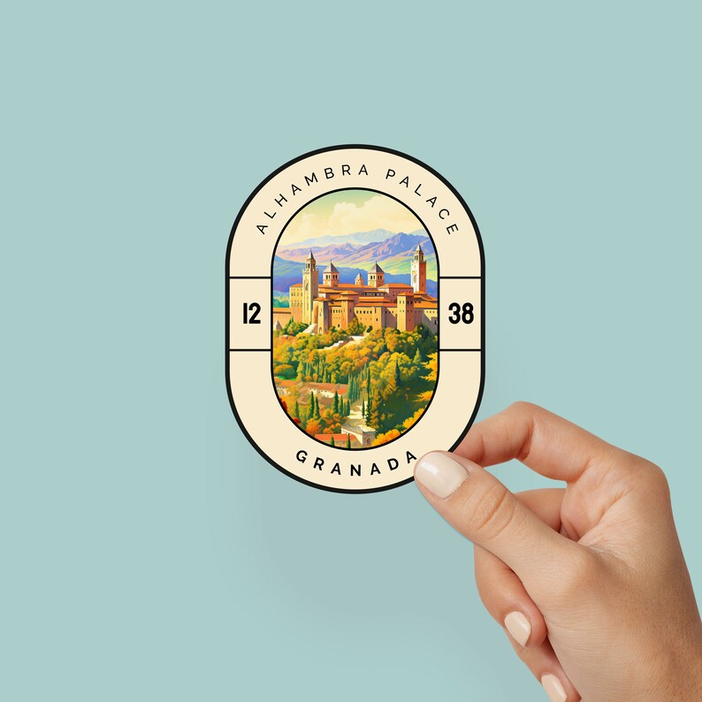 May include: A vintage-style sticker with a beige background and a brown border. The sticker features a colorful illustration of the Alhambra Palace in Granada, Spain. The text "ALHAMBRA PALACE" is written in a brown font around the top of the sticker. The text "GRANADA" is written in a brown font at the bottom of the sticker. The numbers "12" and "38" are written in a brown font on the left and right sides of the sticker.