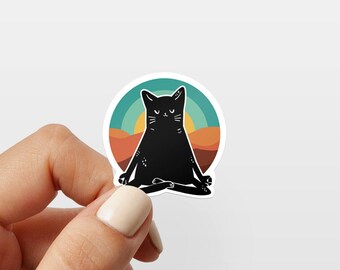 May include: A black cat meditating in a yoga pose against a colorful sunset background. The cat has closed eyes and a serene expression. The sticker is perfect for adding a touch of whimsy to any surface.