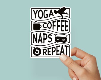 May include: Black and white sticker with the text "Yoga, Coffee, Naps, Repeat" with icons of a yoga pose, a coffee cup, a sleep mask, and a circular arrow.