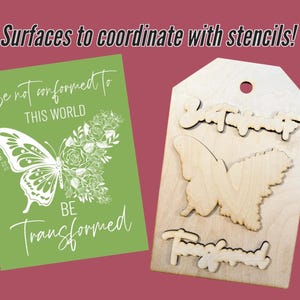May include: A green card with white text and a butterfly design. The text reads "Be not conformed to this world" and "Be transformed". A wooden tag with a butterfly and the words "Be Transformed" cut out.